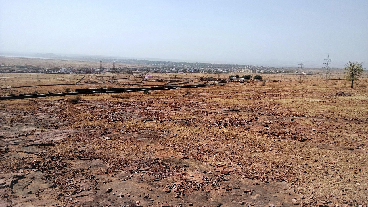 india, desert, barren land, city in background, dry soil, brown desert, desert, barren land, nature, barren land, barren land, barren land, barren land, dry soil